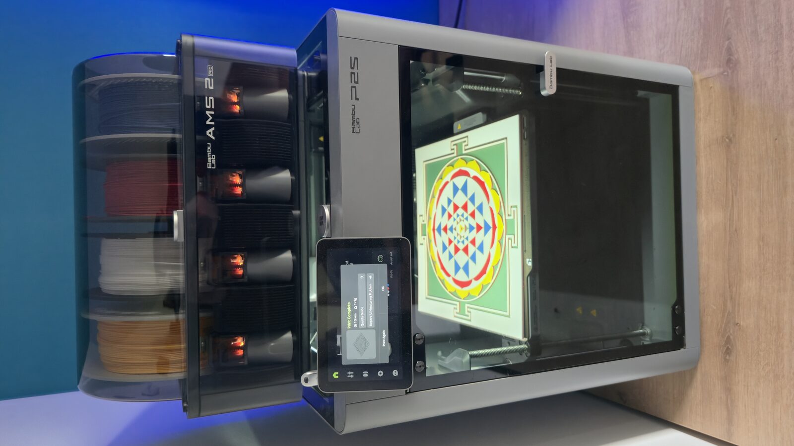 3D printer with color filament spools and the Sri Yantra print in progress